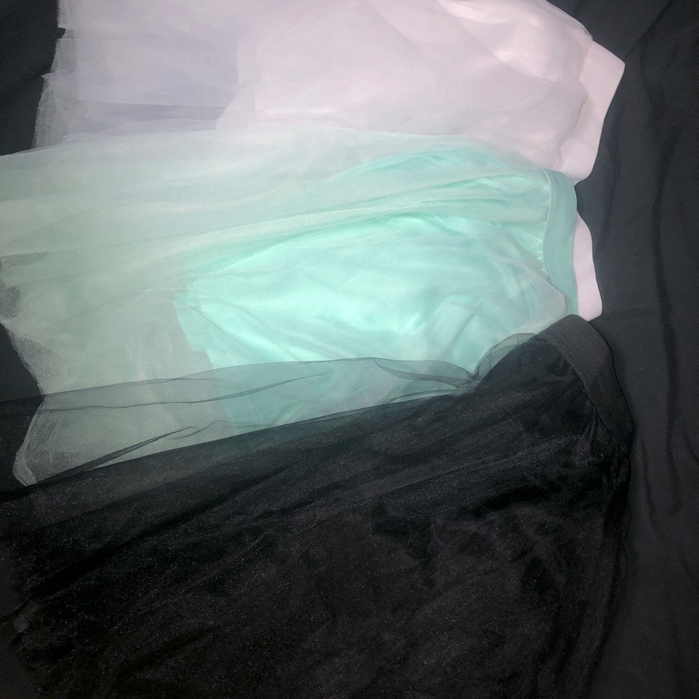 Three tulle skirts. Mint, white, and black.